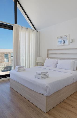 Ένα ή περισσότερα κρεβάτια σε δωμάτιο στο VESTA - Soma Bay Residence