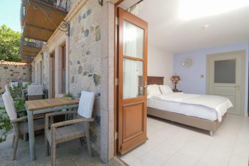 Postel nebo postele na pokoji v ubytování Cunda Labris Hotel
