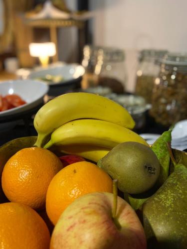 a pile of fruit with bananas apples and pears at HVN10 - Near Antwerp in Stabroek