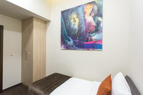 Postel nebo postele na pokoji v ubytování Hotel Grand Hedonist