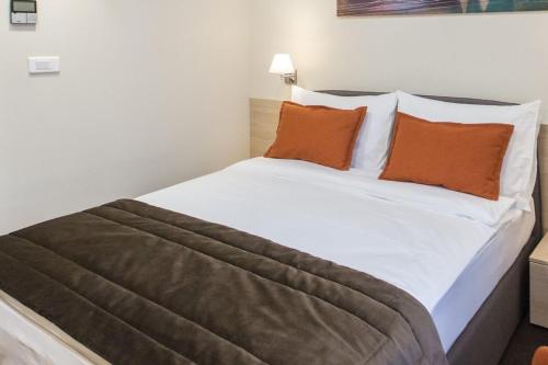 Postel nebo postele na pokoji v ubytování Hotel Grand Hedonist