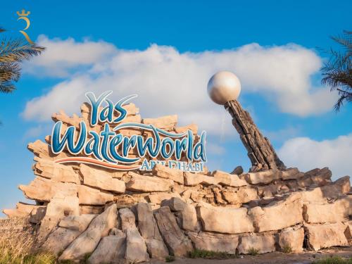 a sign for the walt disney world attraction at Yas Escape - Stylish Boho Studio with Pool, Near Yas Mall in Abu Dhabi