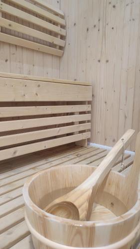 a wooden tub sitting in a sauna at Chalet Le Refuge in Vaujany