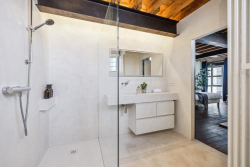 a bathroom with a shower and a sink at Industrial loft near the center of Ghent in Ghent