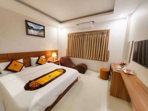 a bedroom with a large bed in a room at Tuấn Linh Hotel in Ha Long