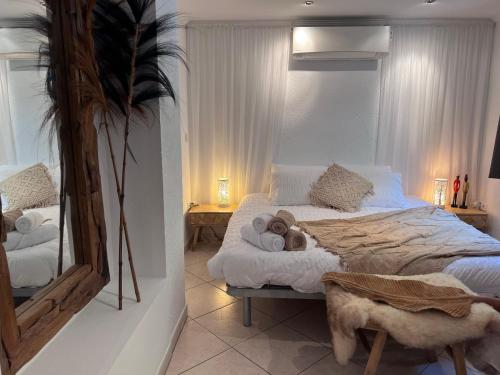 a bedroom with a large bed with towels on it at Boutique Casa Lapicida in Calpe