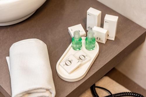 a bathroom counter with two bottles on a table at The Place - Only Self Check-in - No Reception in Trento