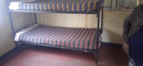 a small bunk bed in a small room with at Kioneki hostels in Nairobi