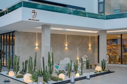 a lobby of a building with cactus and chairs at Dali Oriental Seaview Hotel -Dali Erhai in Dali