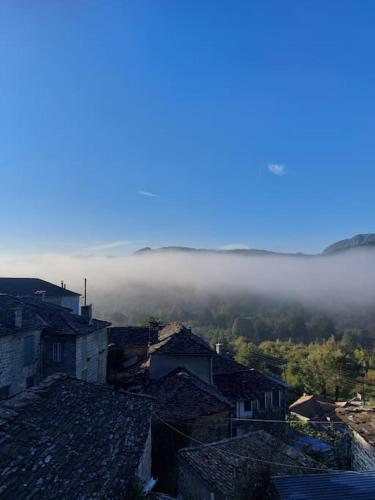 a view of a city with fog in the distance at Το σπίτι στο χωριό in Kipoi