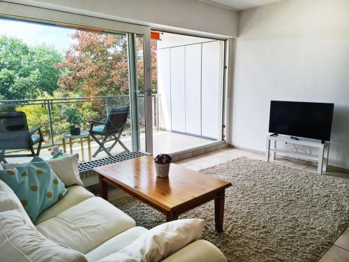 a living room with a couch and a tv at Work & Stay in Wermelskirchen in Wermelskirchen
