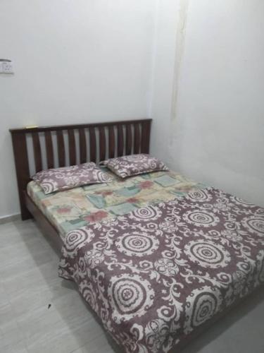 Katil atau katil-katil dalam bilik di Familia Homestay Banggol Ara
