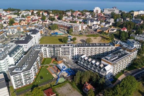 an aerial view of a city with buildings at Sun & Beach Apartments Bel Mare with Parking by Noclegi Renters in Międzyzdroje