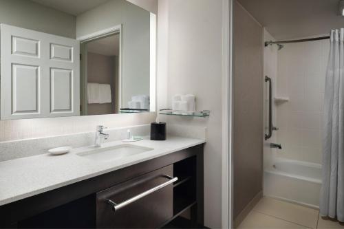 a bathroom with a sink and a shower at Residence Inn by Marriott Stockton in Stockton