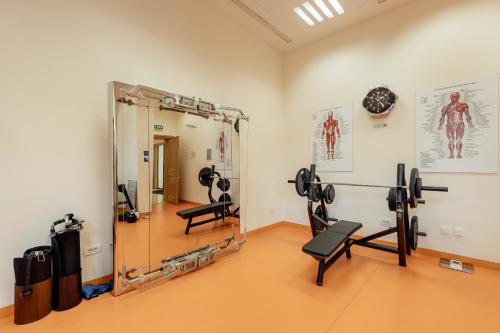 a gym with a mirror and some equipment in a room at Porto Montenegro in Tivat