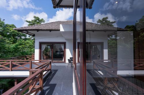 a view of a house from the balcony at ELIVAAS 4 BHK with Pvt Pool & Entertainment Room - Indah in Old Goa