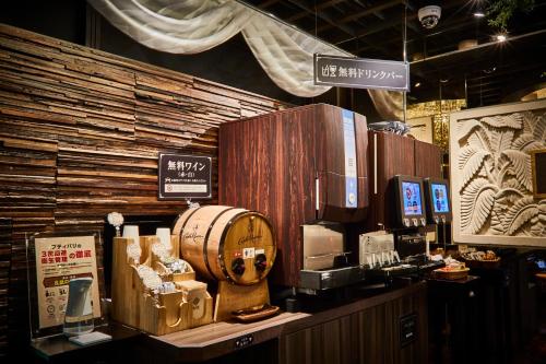 a store with a counter with a display of appliances at Petit Bali Ikebukuro in Tokyo