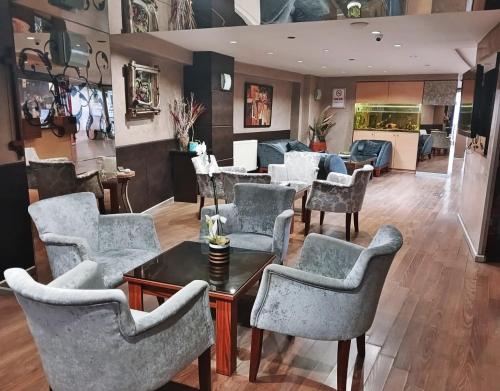 a living room with chairs and a table at Hotel Süreyya in Istanbul