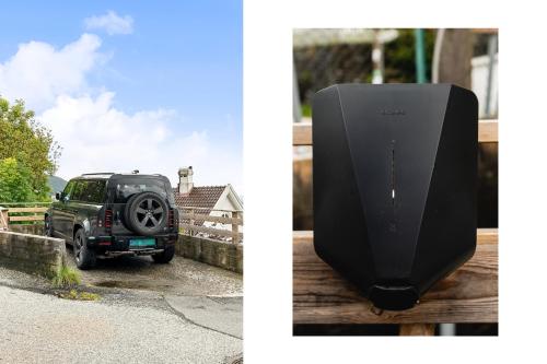 a black car parked next to a house and a black speaker at Dinbnb Homes I Luxury Villa with Hot Tub & Views in Bergen