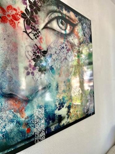 a painting of a woman with an eye on a wall at Ruim comfortabel appartement centrum Breda MET restaurant! in Breda