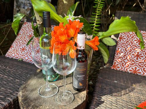 two bottles of wine and two wine glasses on a table at The Red Barn right in the heart of historic Berry in Berry