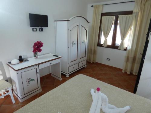 Ένα ή περισσότερα κρεβάτια σε δωμάτιο στο Agriturismo La Rocca Manna