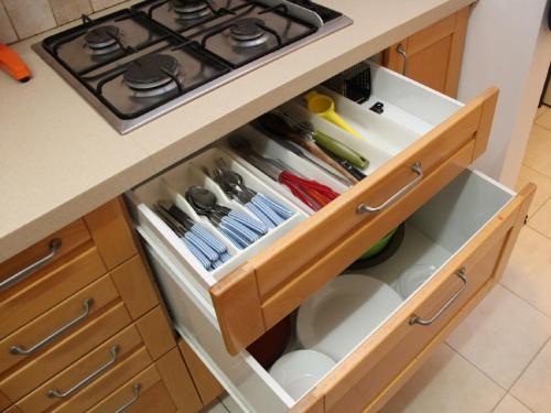 a kitchen island with a stove and a drawer at Kfar Saba View Apartment in Kefar Sava