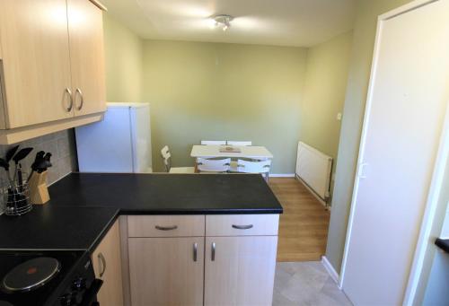 a kitchen with a sink and a counter top at St James House - Charming 3 bed, 2 bathrooms, driveway parking, close to town centre in Newcastle upon Tyne