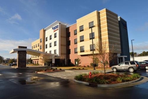 a parking lot in front of a large building at Fairfield Inn & Suites by Marriott Dunn I-95 in Dunn