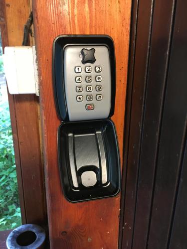 a remote control sticking out of a door at Chata Machnatô - Jasná in Demanovska Dolina