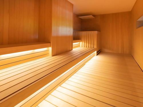 an empty sauna with wooden paneling and wooden floors at ANA InterContinental Appi Kogen Resort by IHG in Hachimantai