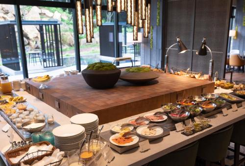 a buffet of food on a table in a room at ANA InterContinental Appi Kogen Resort by IHG in Hachimantai