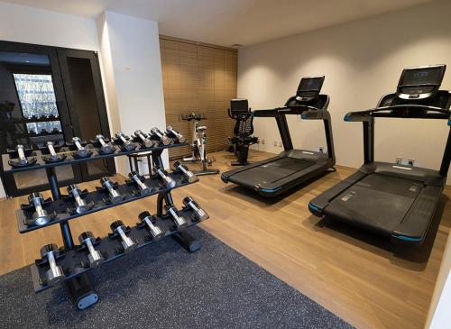 a gym with several treadmills and exercise machines at ANA InterContinental Appi Kogen Resort by IHG in Hachimantai