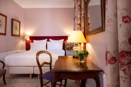 Postel nebo postele na pokoji v ubytování Hôtel Le Saint Gregoire