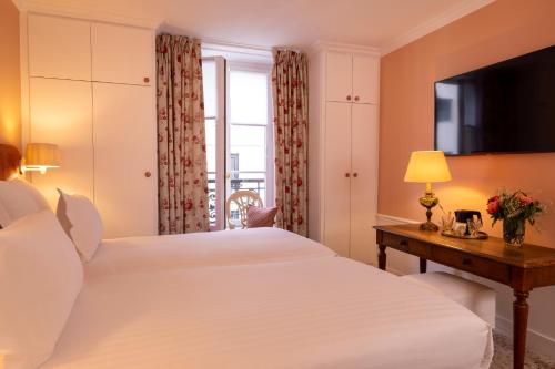 Postel nebo postele na pokoji v ubytování Hotel Le Saint Gregoire