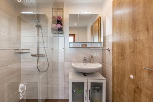 a bathroom with a sink and a shower at Dömer in Kirchhundem