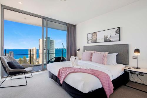 a bedroom with a large bed and a large window at Romantic Getaway in Surfers Paradise - Elston Apartment with Ocean View - Wow Stay in Gold Coast