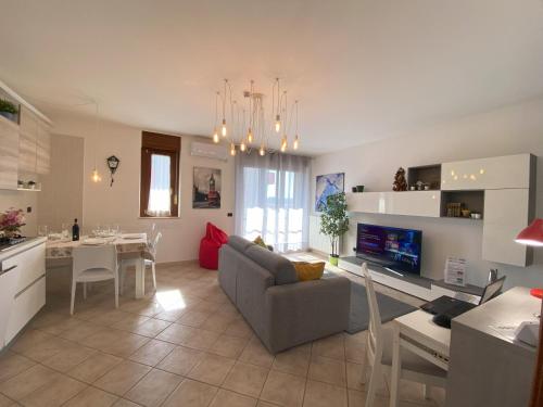 a living room and kitchen with a couch and a table at F&G 71100 - - Colazione inclusa - Box auto privato su richiesta in Foggia