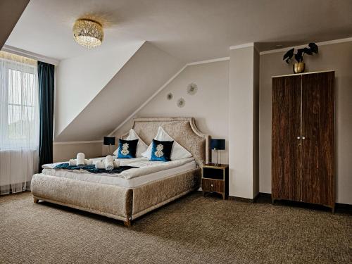Posteľ alebo postele v izbe v ubytovaní Pensjonat Miedziana Perła