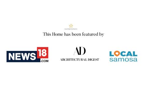 a logo for a home home has been identified by nad at SaffronStays Kaia Waters by Kosha Villas, Pawna - Greek style villa with panoramic view of Pawna lake in Kolvan