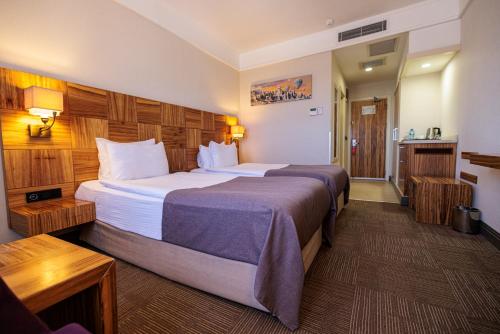 Postel nebo postele na pokoji v ubytování Ramada By Wyndham Cappadocia