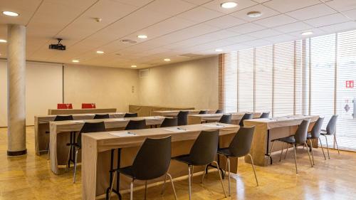 a conference room with tables and chairs in it at Seth Port Ciutadella in Ciutadella