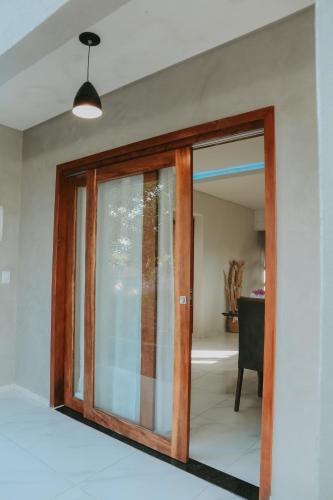 a sliding glass door in a room at Vila hangloose pôr do sol in Acaraú