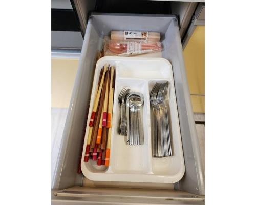 a drawer full of utensils in a refrigerator at Ohama House in Sumoto