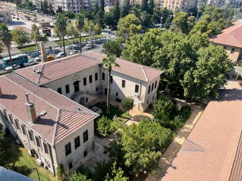 an aerial view of an old building with a tree at Kançul Hotel Taştepeler in Sanlıurfa