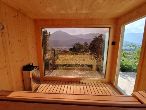 a window in a cabin with a view at Videre Doppelzimmer in Gargazzone