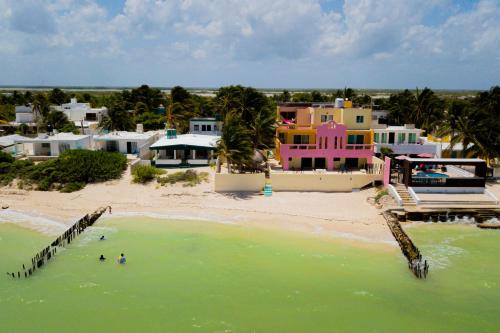 an aerial view of a beach with houses at Hotel Flamingos Inn in Chuburná