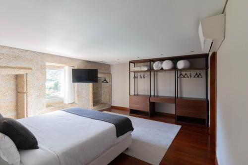 Postel nebo postele na pokoji v ubytování Recanto de Passos - Amarante