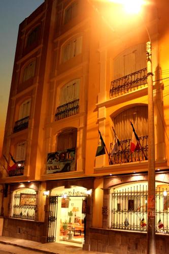 a building with a street light in front of it at Sol Plaza Hotel in Puno