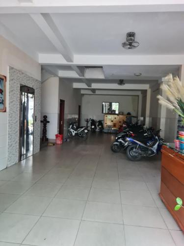 a living room with two motorcycles parked in it at Khách sạn Dạ Lan in Ðông Hòa